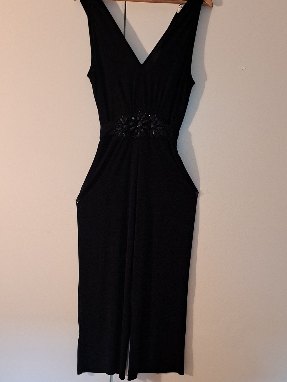 Beige by eci Black Sleeveless V-Neck Jumpsuit with Embellished Waist